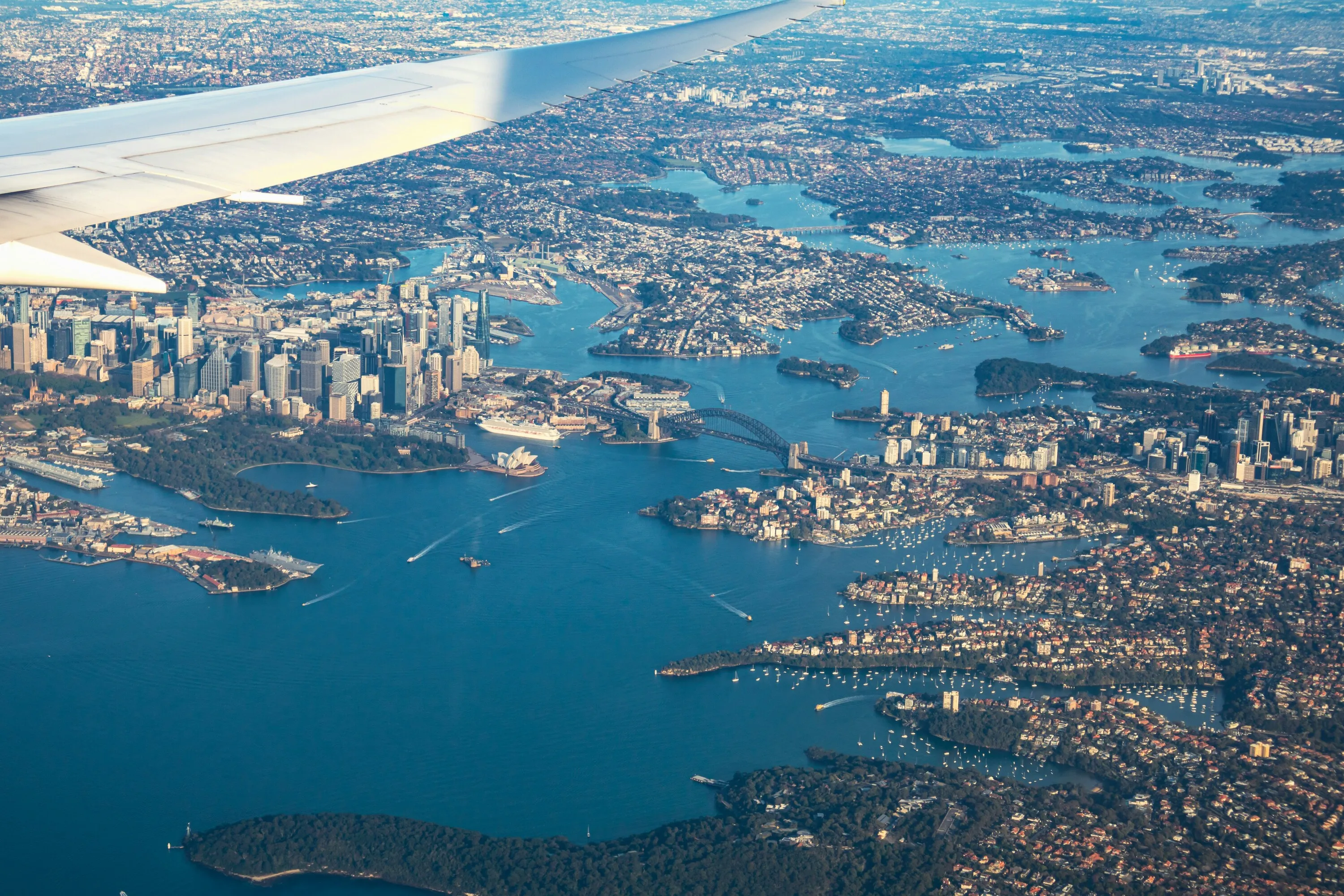 Plane flying over Sydney Harbour