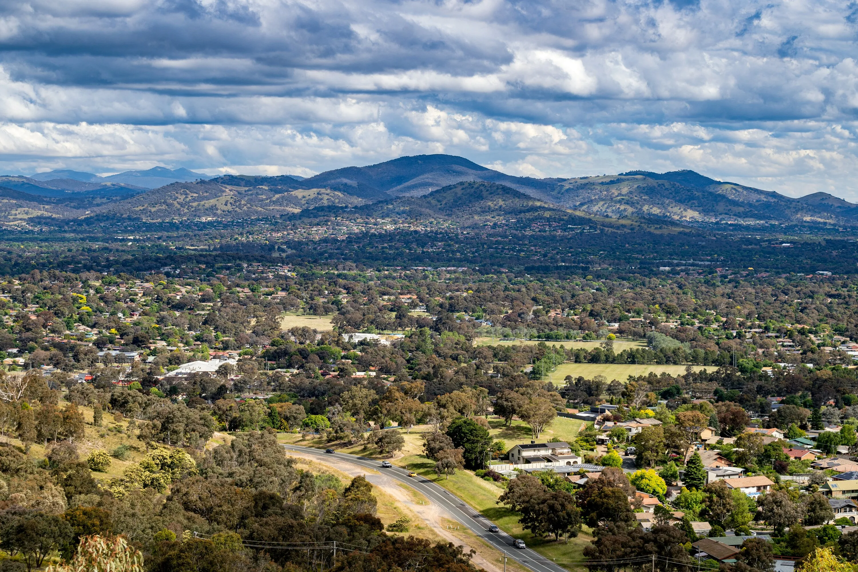 Aerial view of a town surrounded by mountains