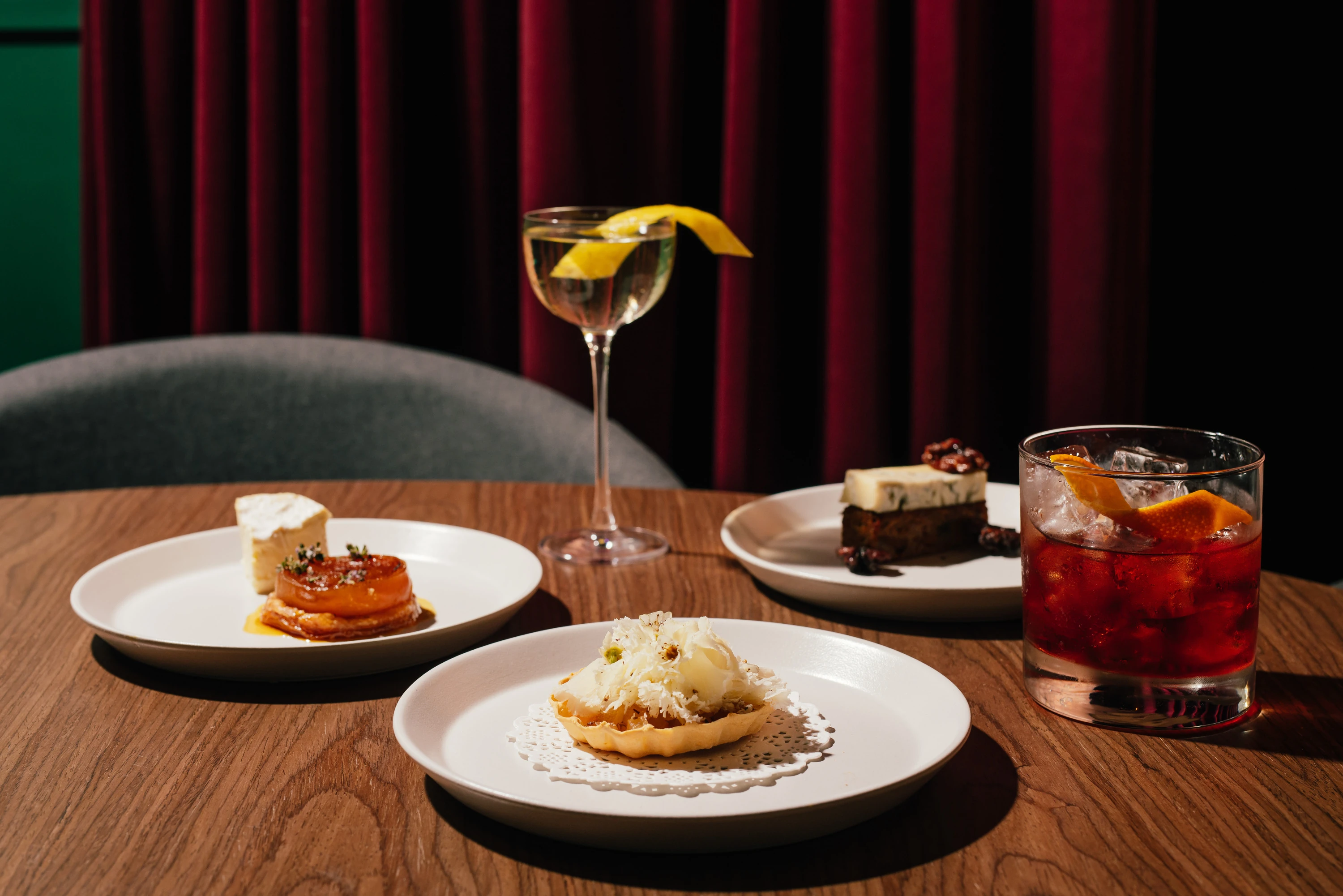 Assorted cocktails and snacks at Death and Co.