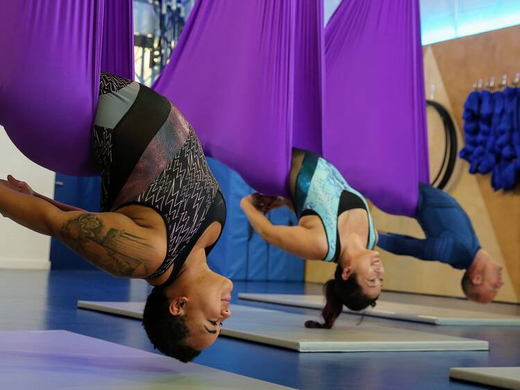 Do a downward dog in the air Do a downward dog in the air