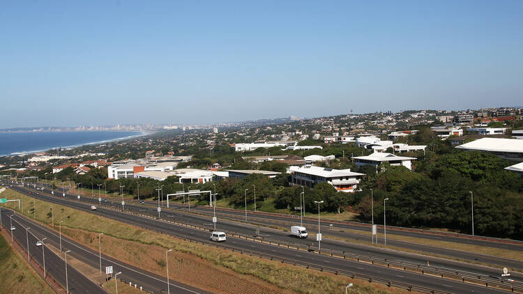 Highway Heading Toward and Leaving Coastal Urban Landscape