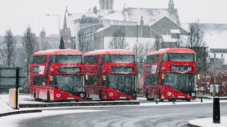London red buses in the snow