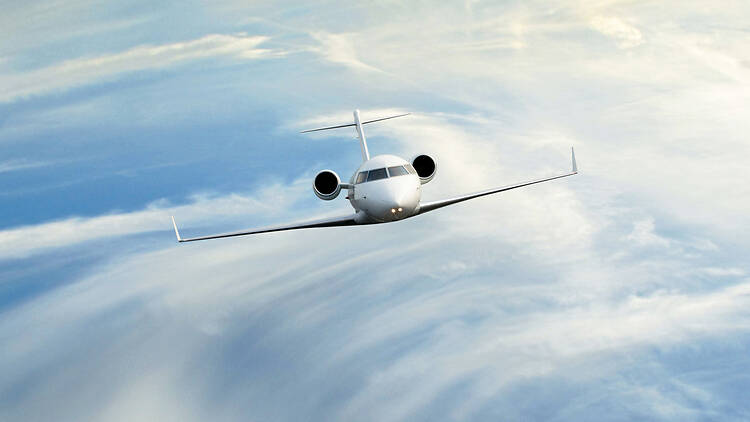 Private jet in the clouds iStock