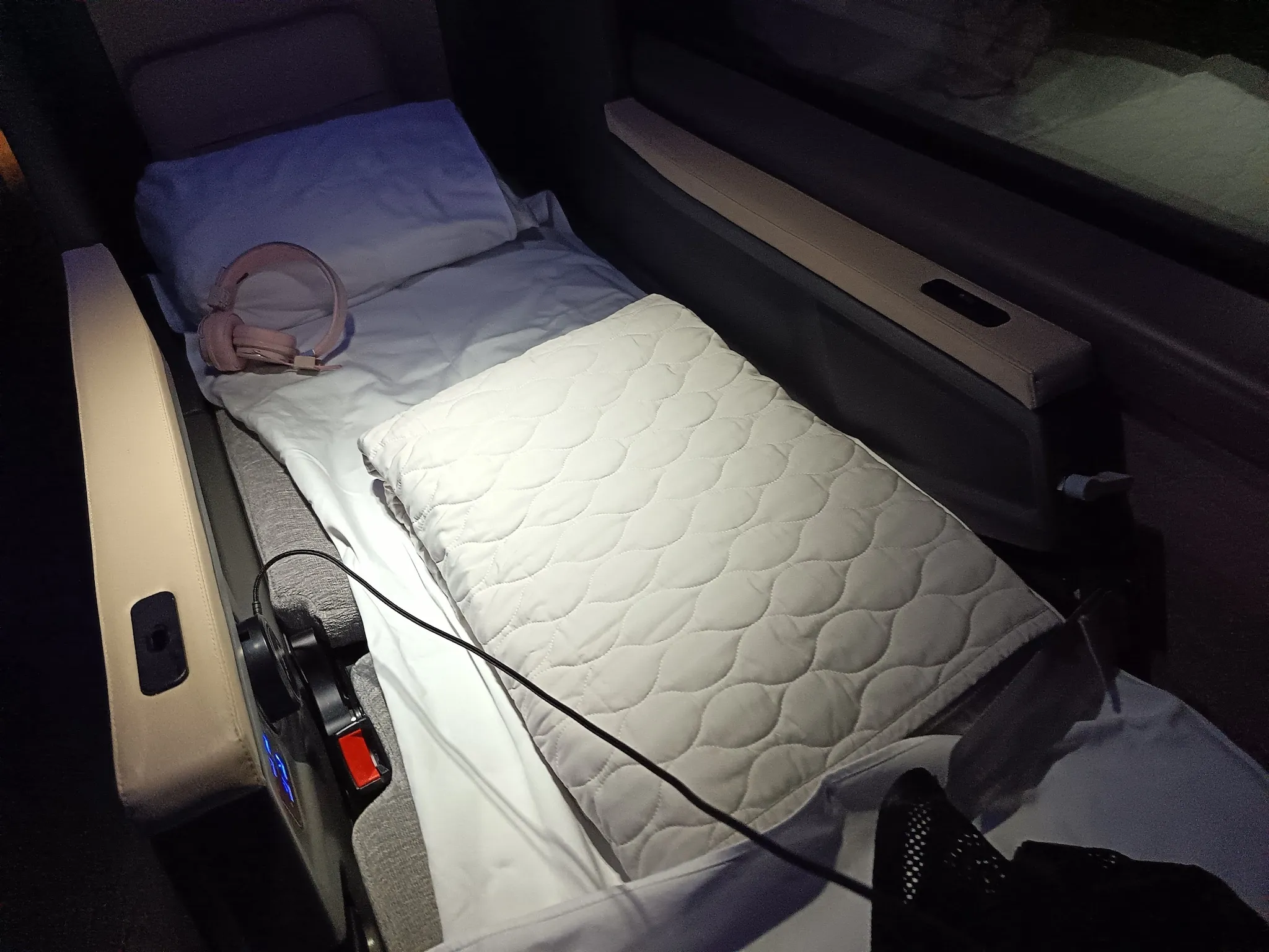 The bed in lie-flat position on Twiliner sleeper bus