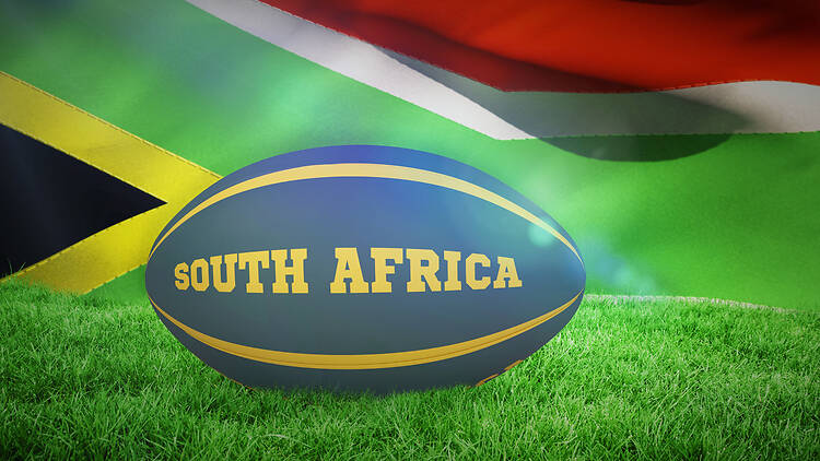 Composite image of south africa rugby ball South Africa rugby ball against flag of south africa