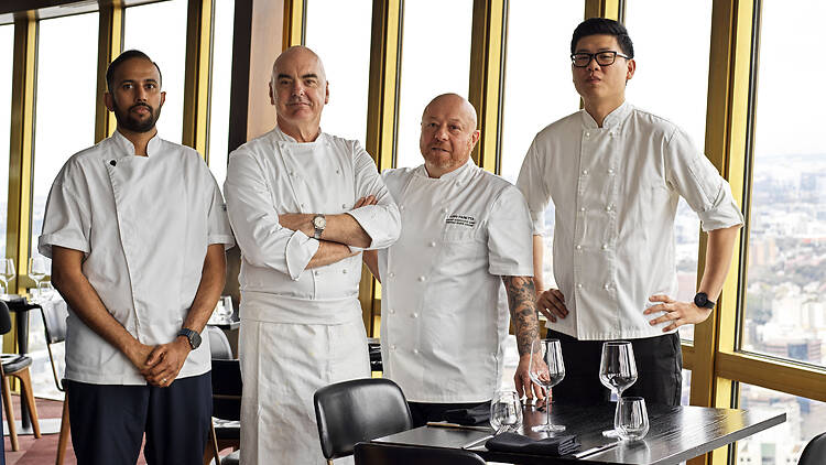 Chefs standing in front of a window