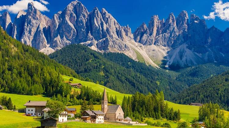 Funes in South Tyrol - famous view of the Odles peaks and The Church of Santa Maddalena