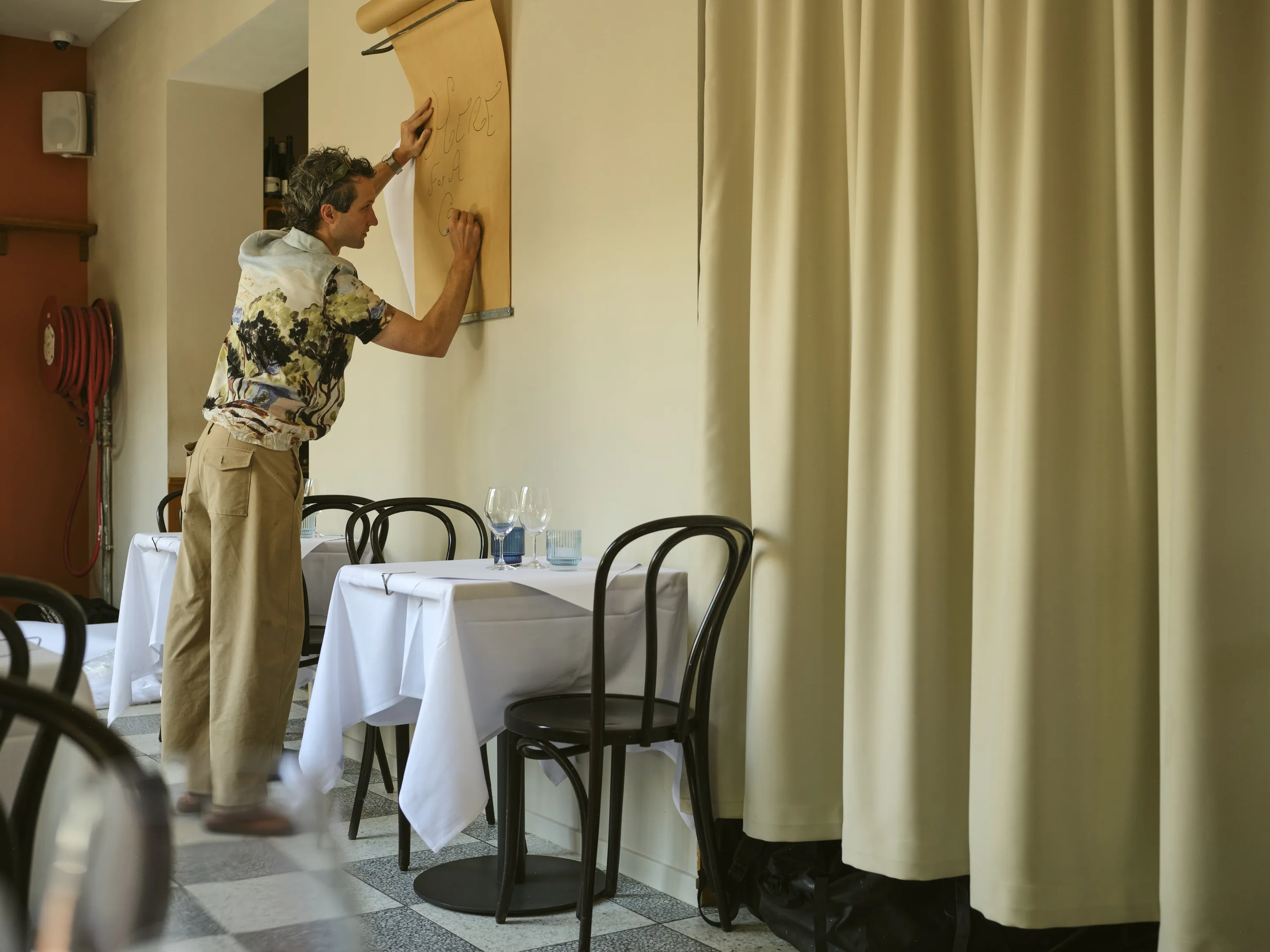 Chef Jordan Clay creating signage at Pipis North.