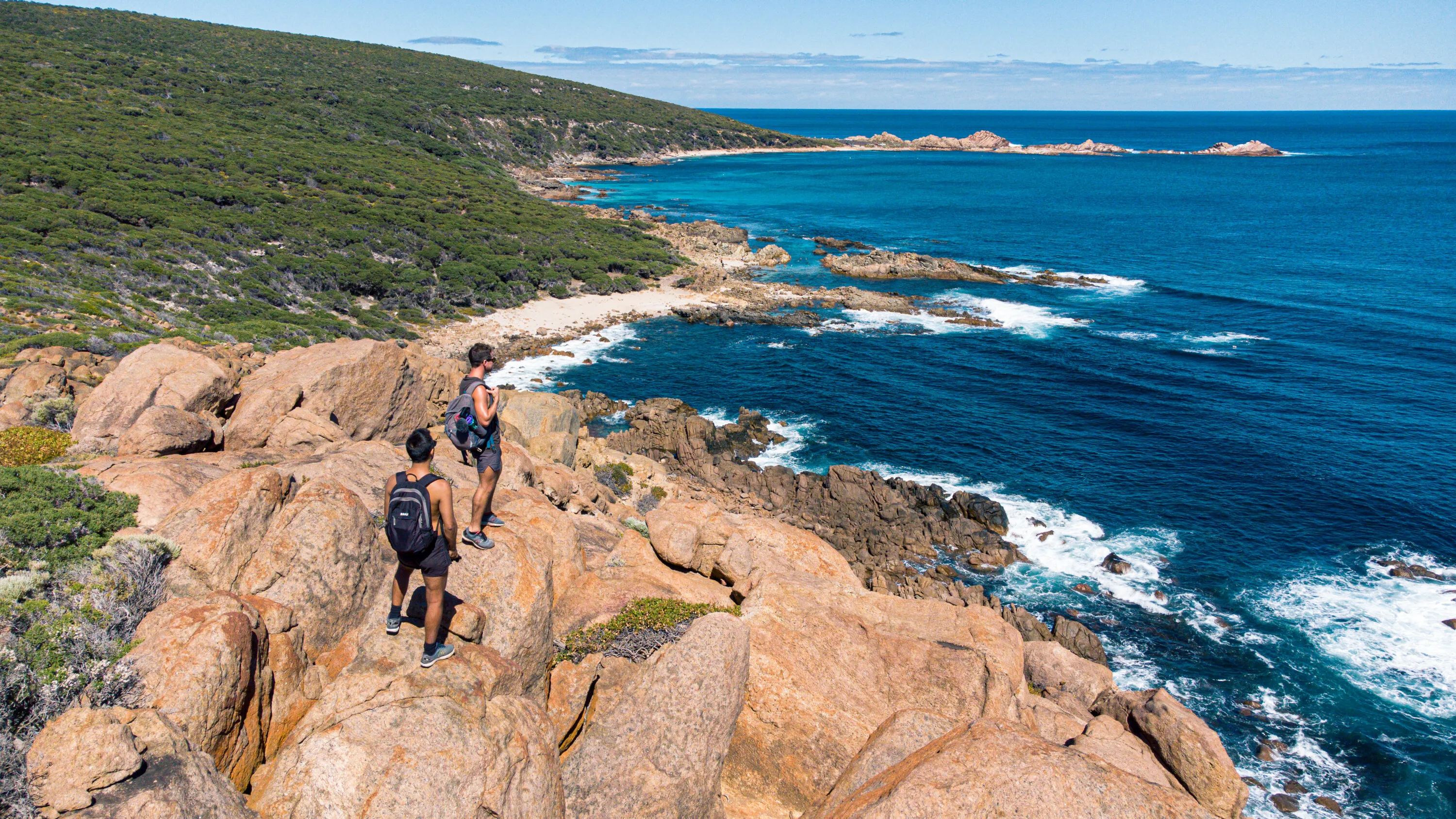 Couple Hiking along the Coast 