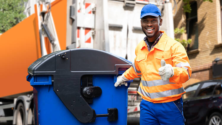 Garbage removal man doing trash and rubbish collection