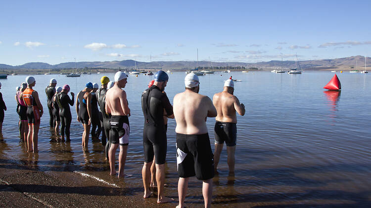 Howick, KwaZulu Natal, South Africa - october 19, 2014:  Many unknown participants start the On LIne Tri Series Race 1 triathlon at Midmar Dam in the Natal midlands