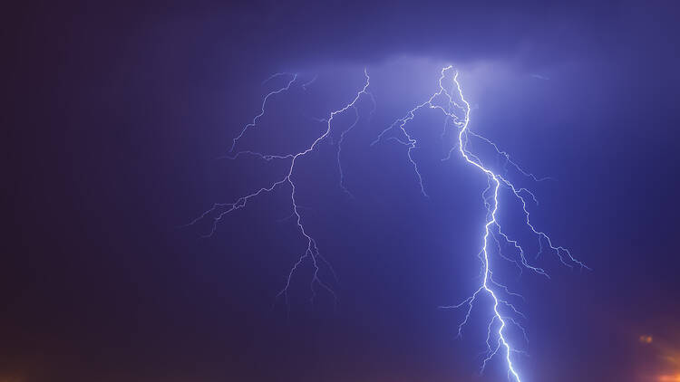 Cloud to ground bright lightning strike over Johannesburg at nighttime A cloud to ground bright lightning strike over Johannesburg at nighttime