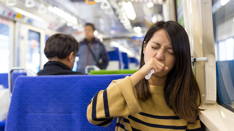 Coughing woman on metro Coughing woman on metro