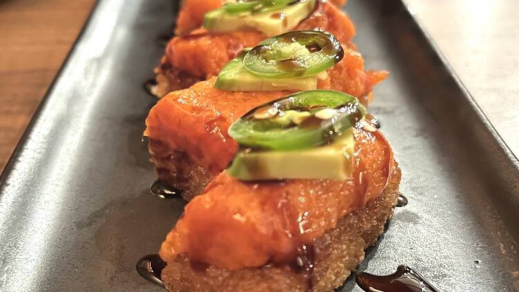 Crispy rice with jalapeno on top