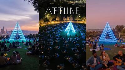 Attune 1.0 A public light installation in fields where people are picnicking.