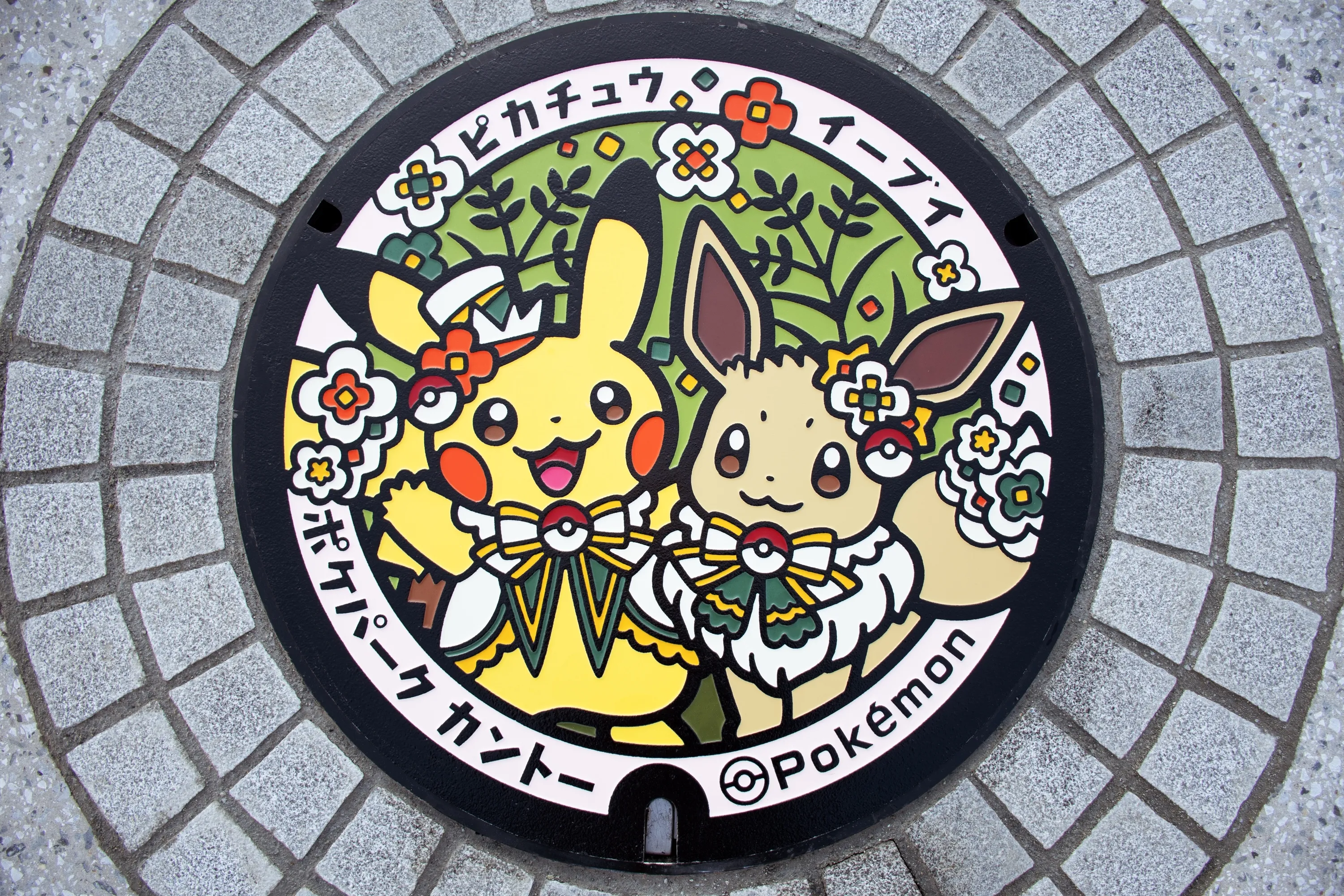 Pikachu and Eevee manhole cover