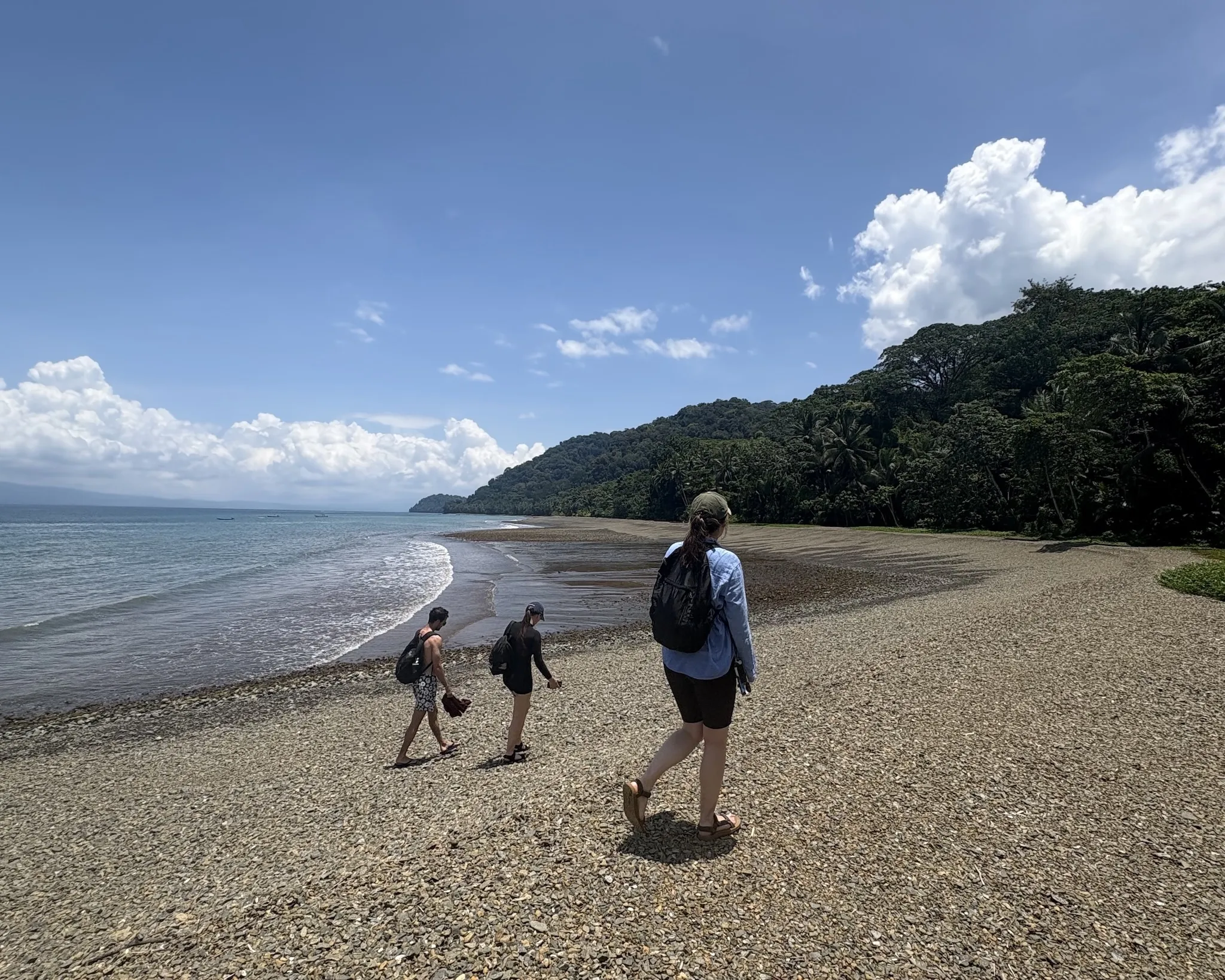 Walking along the empty beach bordering Piedras Blancas National Park