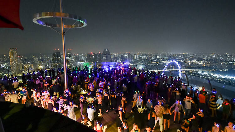 Party atop the Marina Bay Sands at Silent Disco in the Sky