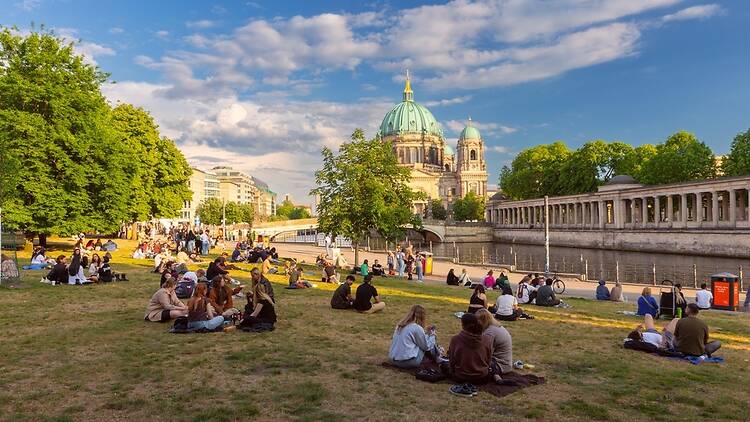 People hanging out by the Spree in Berlin