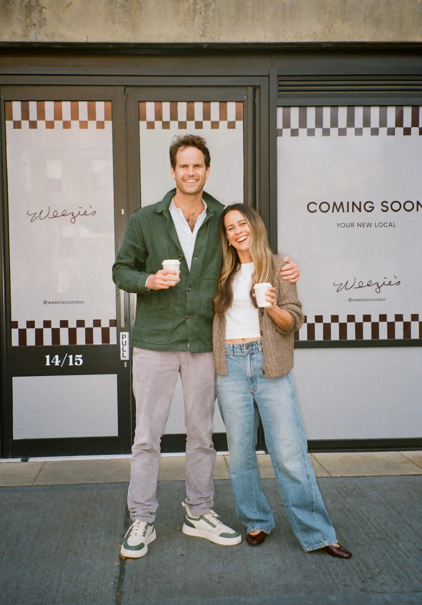 Founders posing in front of the shop