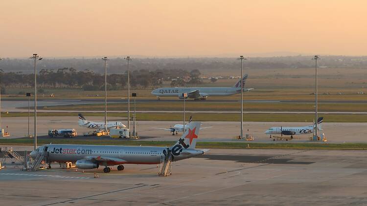 The runway of Melbourne Airport at dusk.