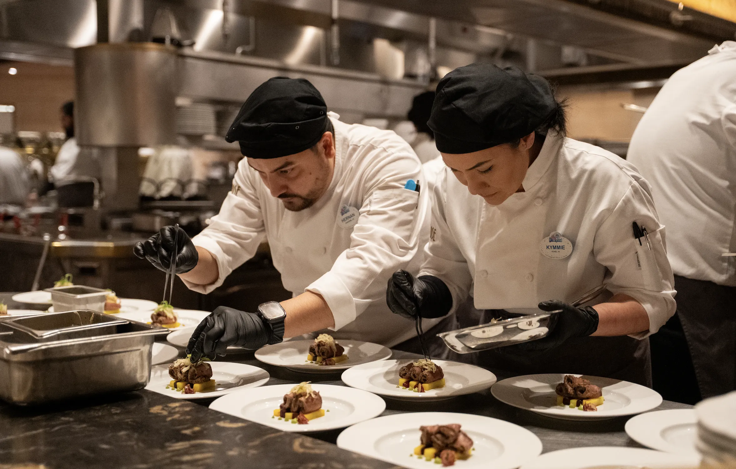 Chefs preparing a wagyu beef dish at Napa Rose.
