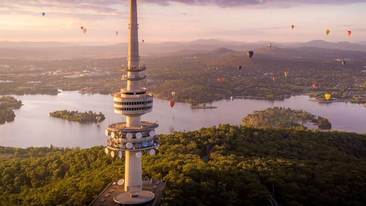 Sky with tower and hot air balloons