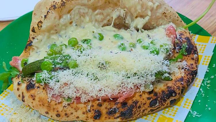 Peas and prosciutto and cheese in a pizza pocket