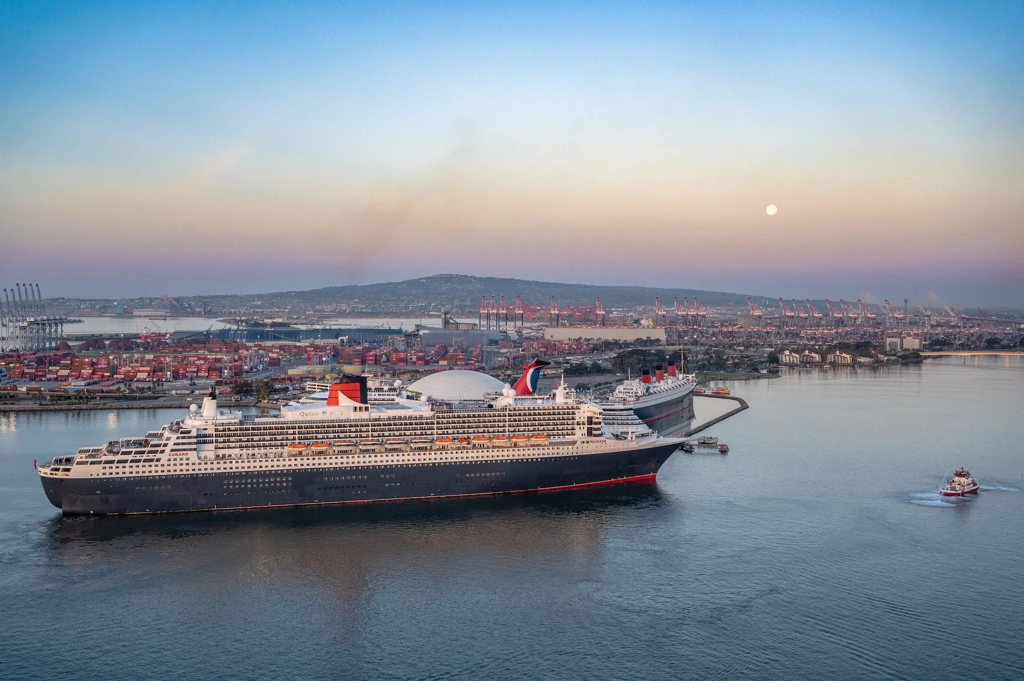 Queen Mary 2 (left) passes Queen Mary (right) in Long Beach