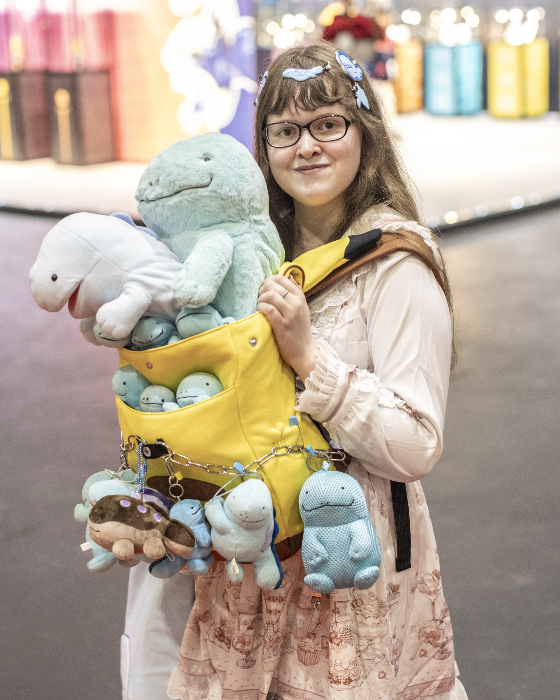 Woman wearing homemade Pokemon outfit adorned with plushes 