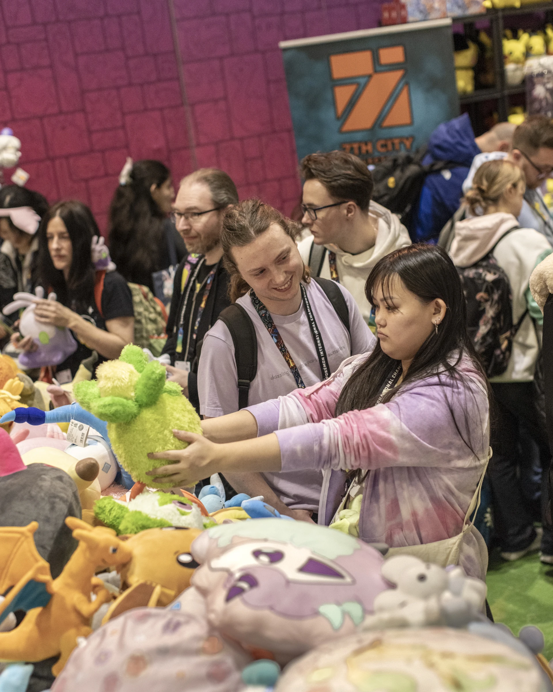 People picking up Pokemon plushes at the Pokemon Championships