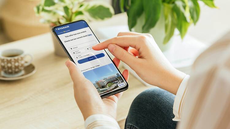 Woman booking flights on Ryanair app