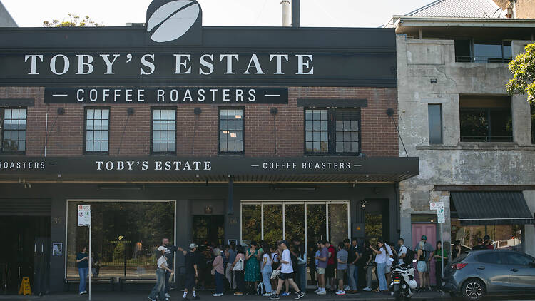 Toby's Estate Cafe exterior with line