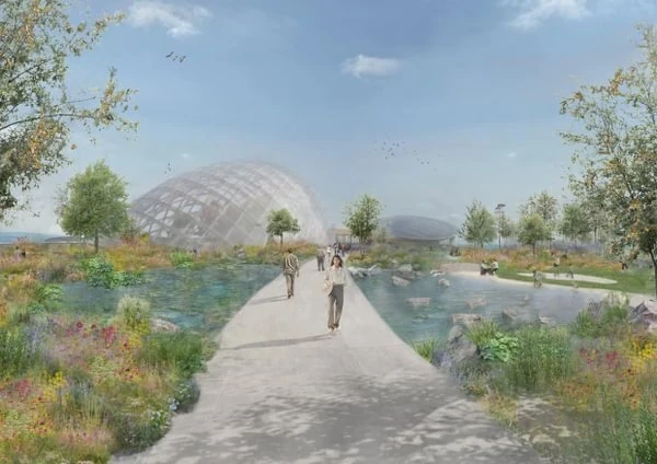 Garden plots and bridge over pond with a large glass dome in the distance