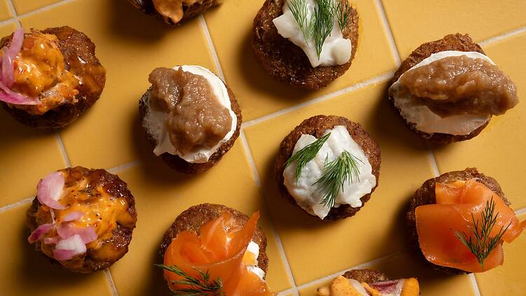 yellow tile counter with lox and spreads on rye bread