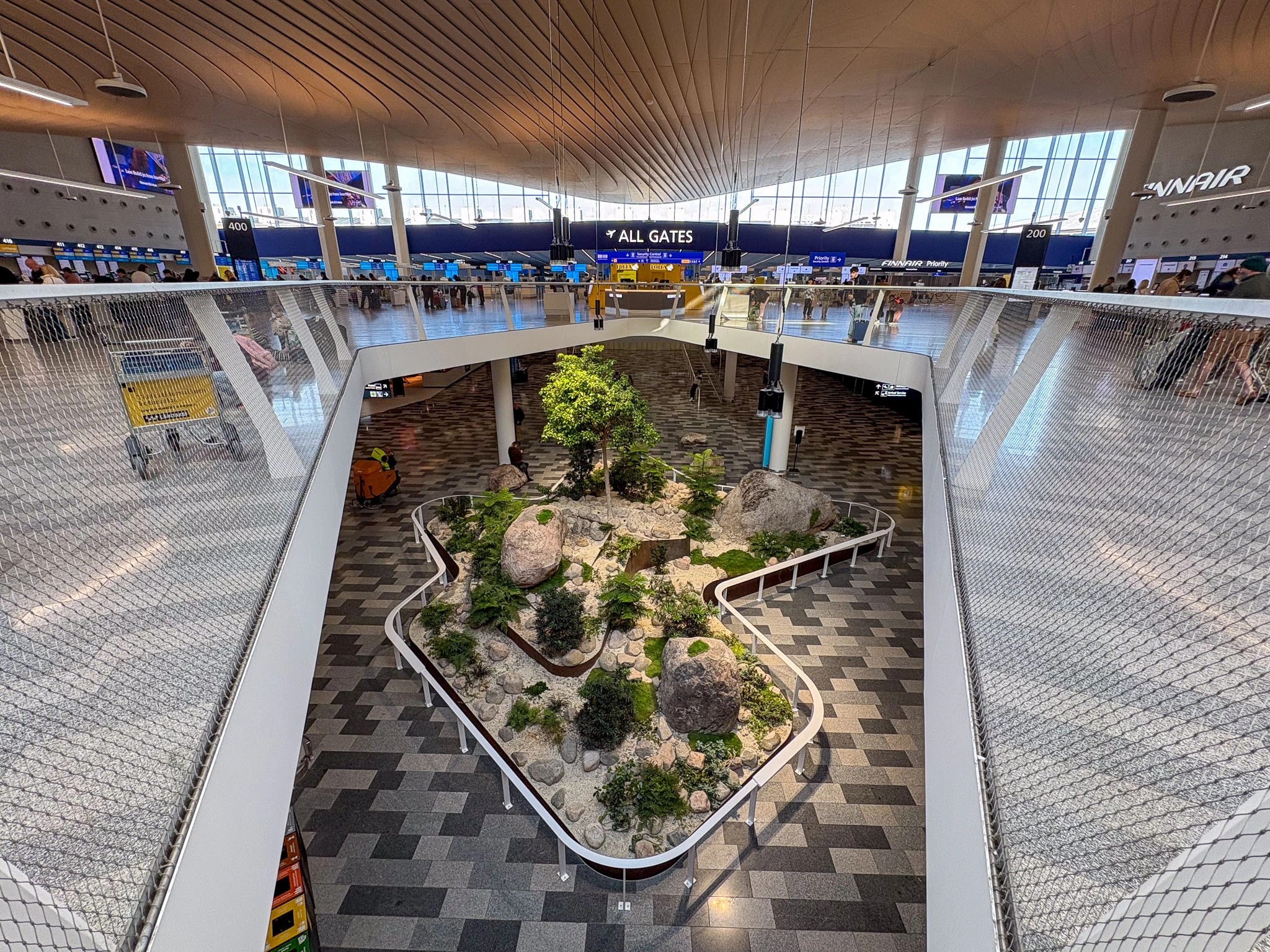 Helsinki Airport arrivals hall, overlooking the lower-level garden.