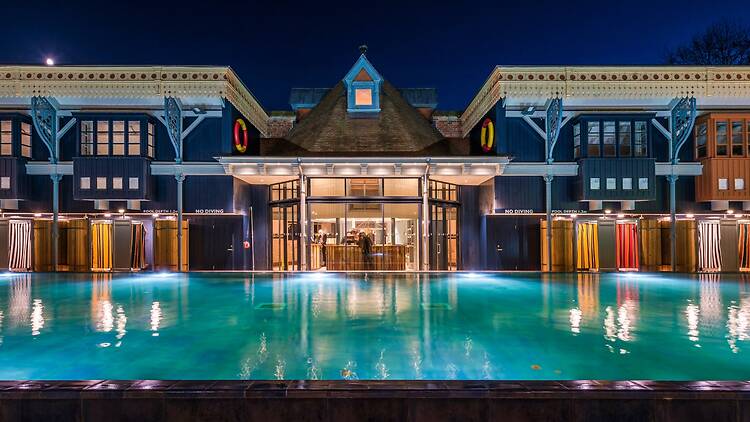 Nightime shot of the main pool at Thames Lido in Reading