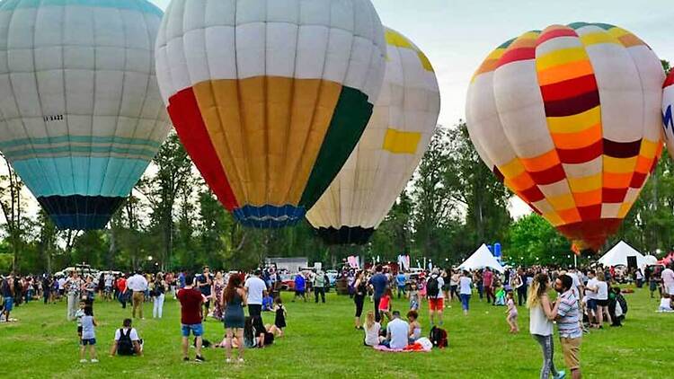 A hot air balloon festival in the heart of the city