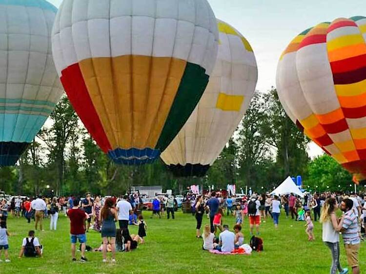 A hot air balloon festival in the heart of the city