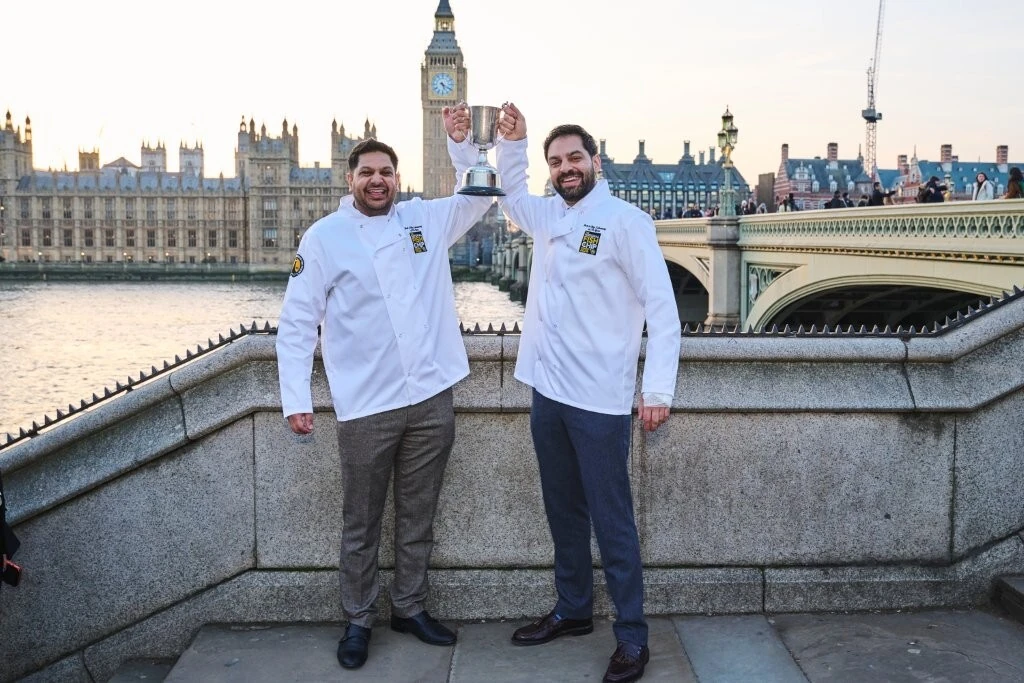 Takeaway of the Year winners hold up their trophy in front of London's Big Ben