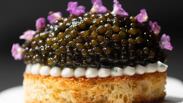 Broiche bread with a mound of caviar on it
