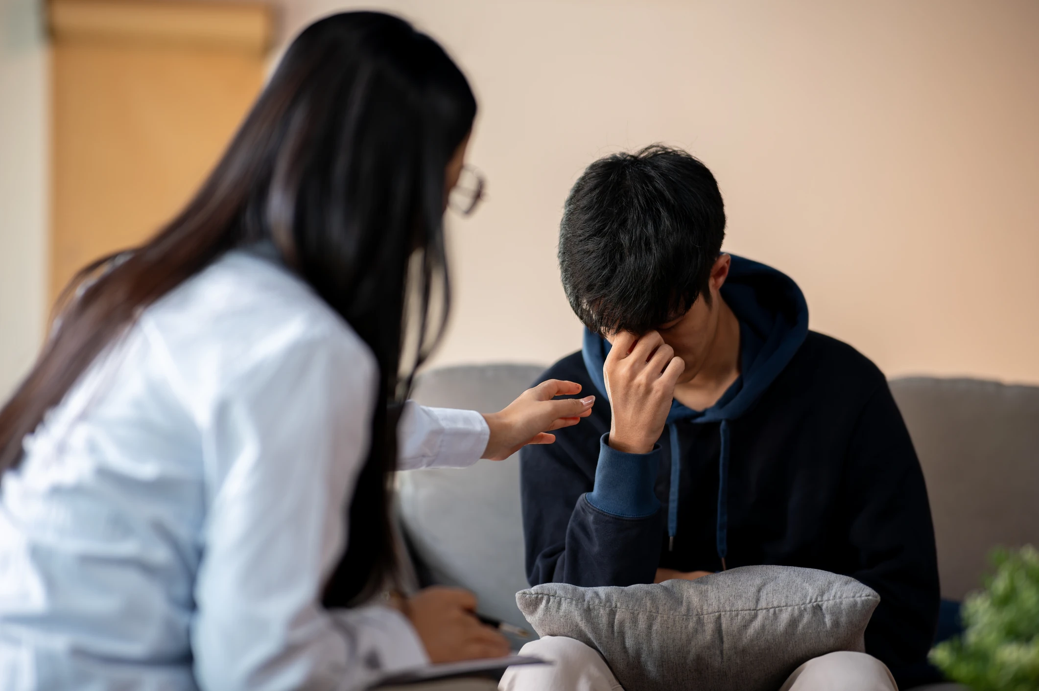 Crying man in counselling session