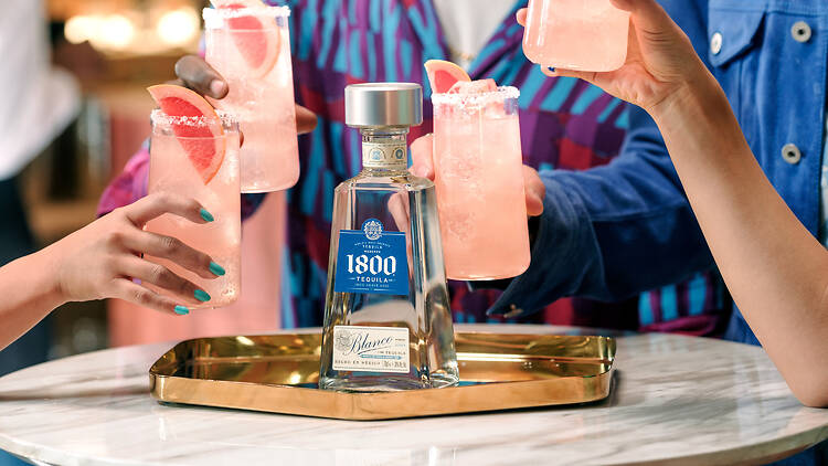 A group of people drinking Paloma cocktails