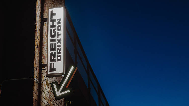 Freight Brixton sign against night sky