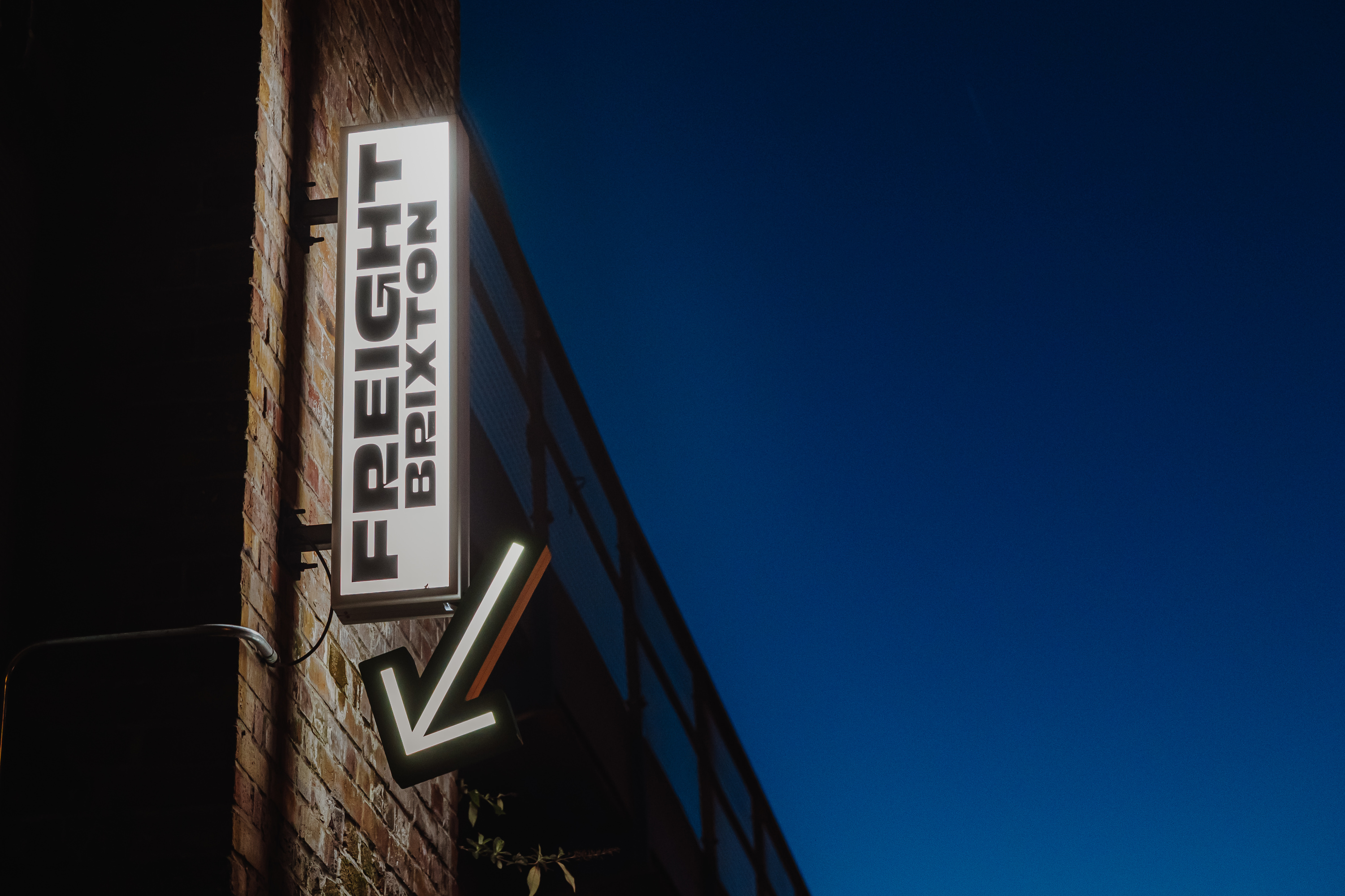 Freight Brixton sign against night sky