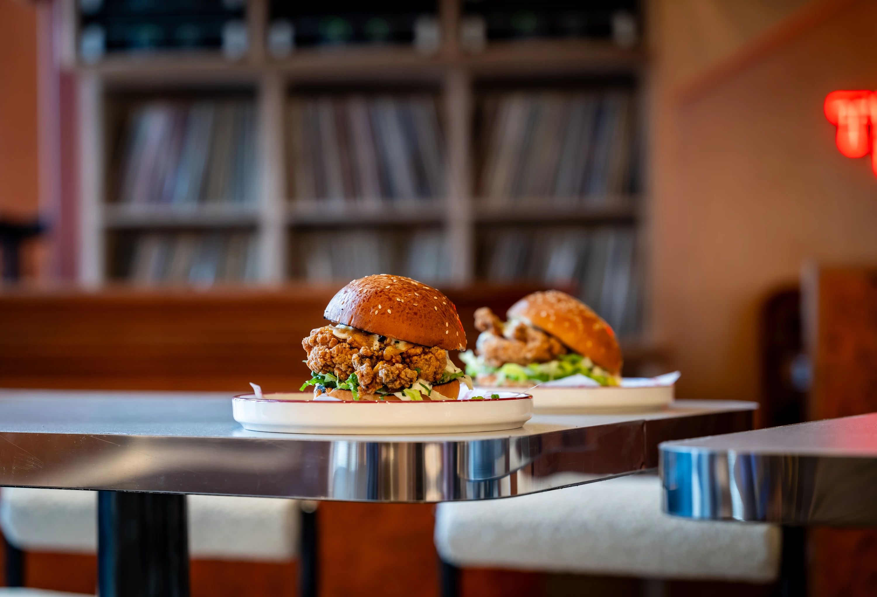 Two burgers on a pub table