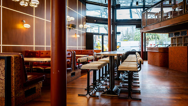 Dark wood panelled interior and tables of Empire Tavern
