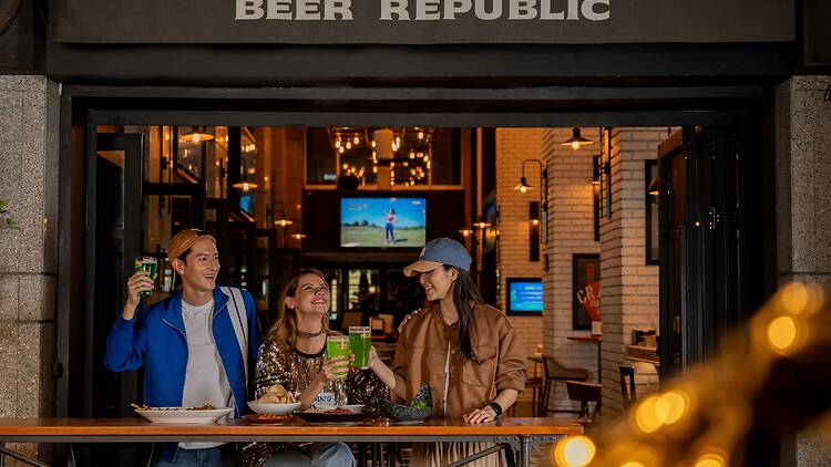Sip inky Guinness beside green-bun burgers at Beer Republic