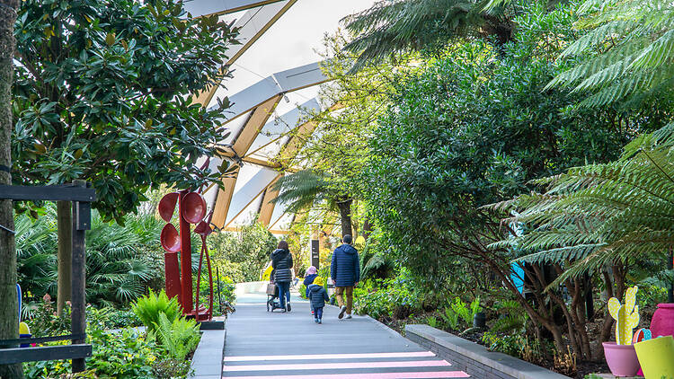 Family walking in London at an indoor garden in Canary Wharf