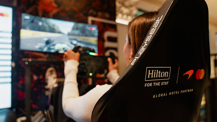 A person on a racing simulator.